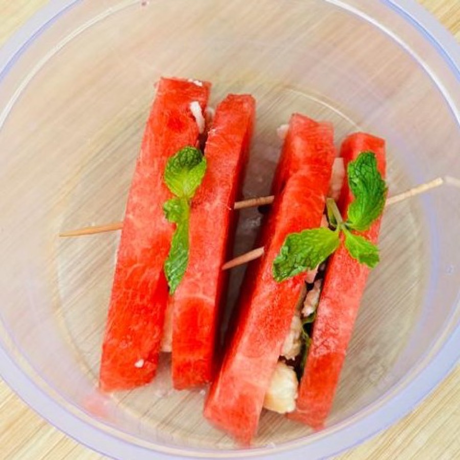 Watermelon Sandwich: watermelon slices with feta cheese and mint on wooden skewers